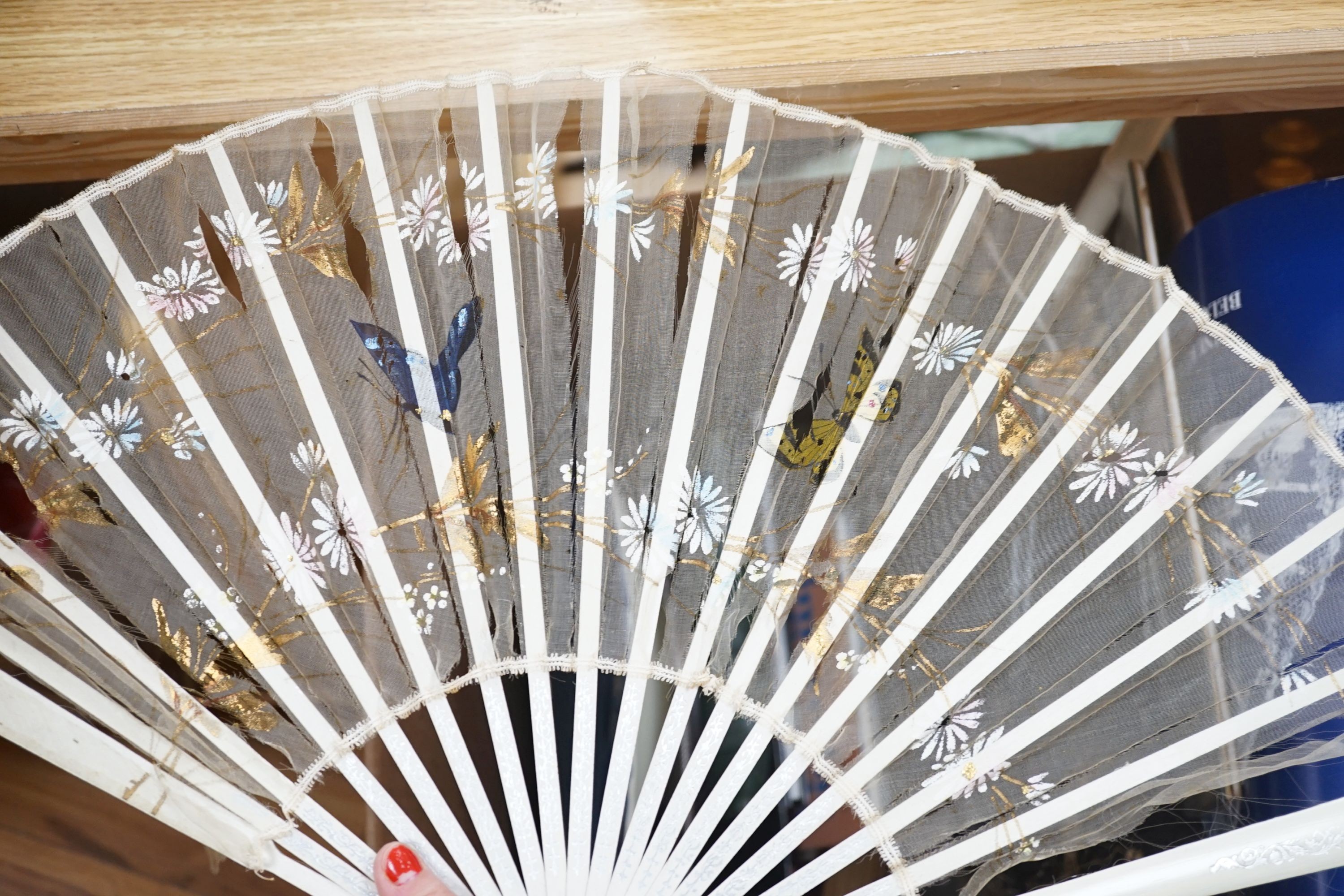 A quantity of lace makers items, Victorian parasols, 7 other fans, a fan frame, a 900 silver bag mount, a silver mother of pearl page turner, and other items